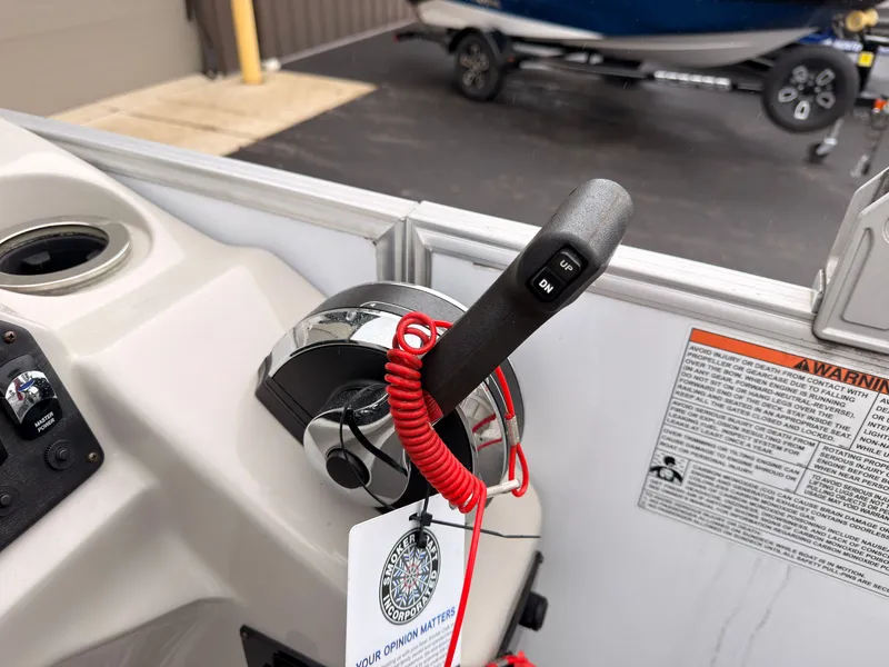 Slide: The Image of Close-up of a boat throttle lever with a red safety cord. - 35