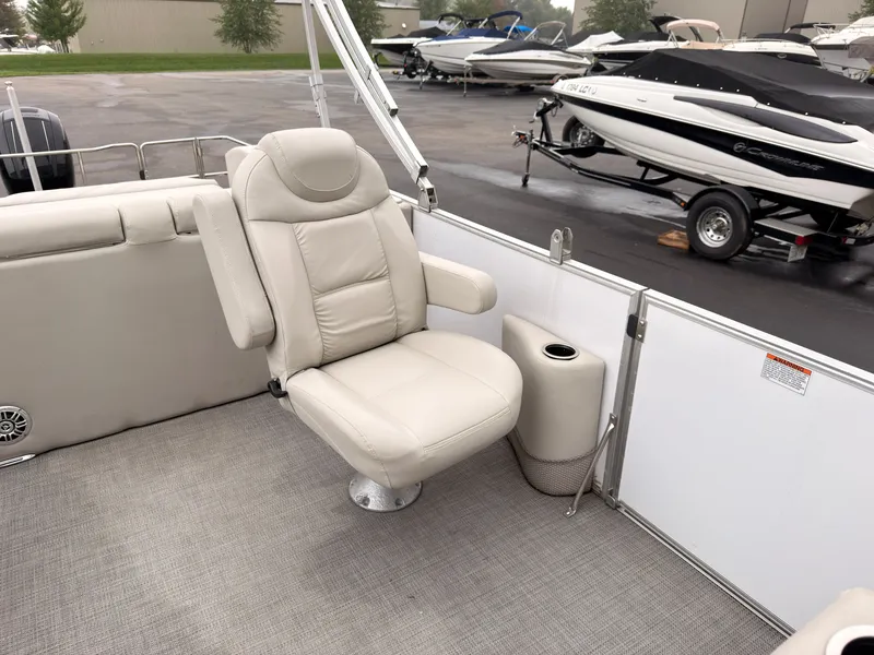 Slide: The Image of A 2017 Sylvan Mirage 8524 DL featuring a beige swivel chair on a gray carpeted floor. - 28
