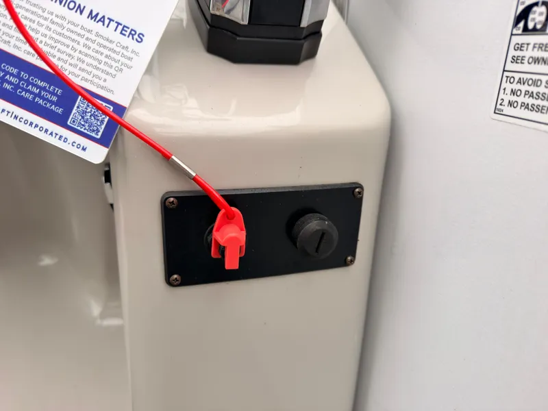 Slide: The Image of Close-up of a boat switch with a red safety lanyard. - 38