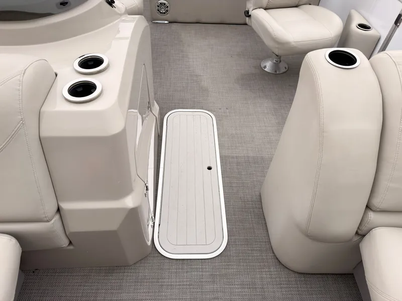 Slide: The Image of The image shows the interior of a 2017 Sylvan MIRAGE 8524 DL with beige seating and flooring. - 20