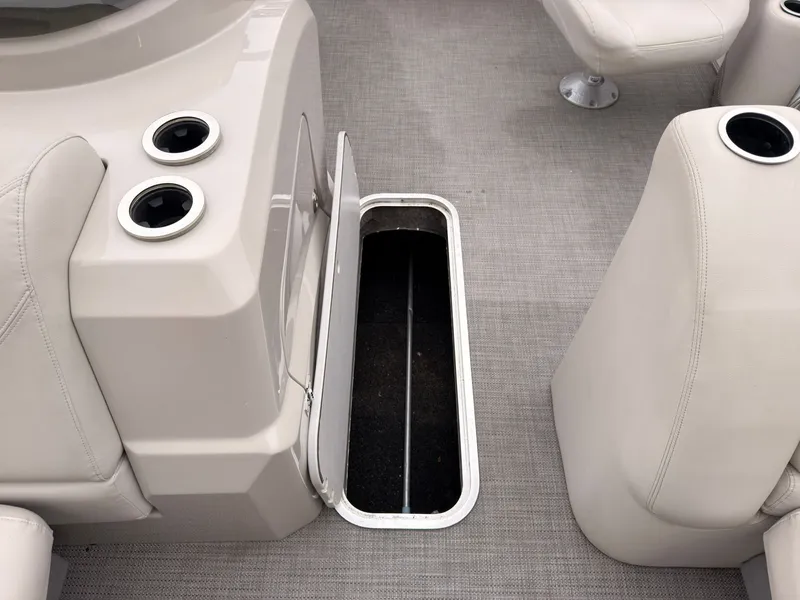 Slide: The Image of The image shows the floor of a 2017 Sylvan MIRAGE 8524 DL with an open storage compartment. - 21