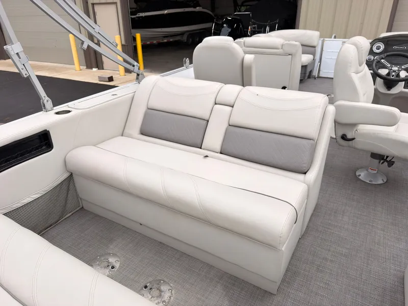 Slide: The Image of The image shows the interior of a 2017 Sylvan MIRAGE 8524 DL with beige seating. - 45