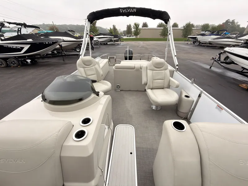 Slide: The Image of The image shows a 2017 Sylvan Mirage 8524 DL pontoon boat with comfortable seating and a modern design. - 26