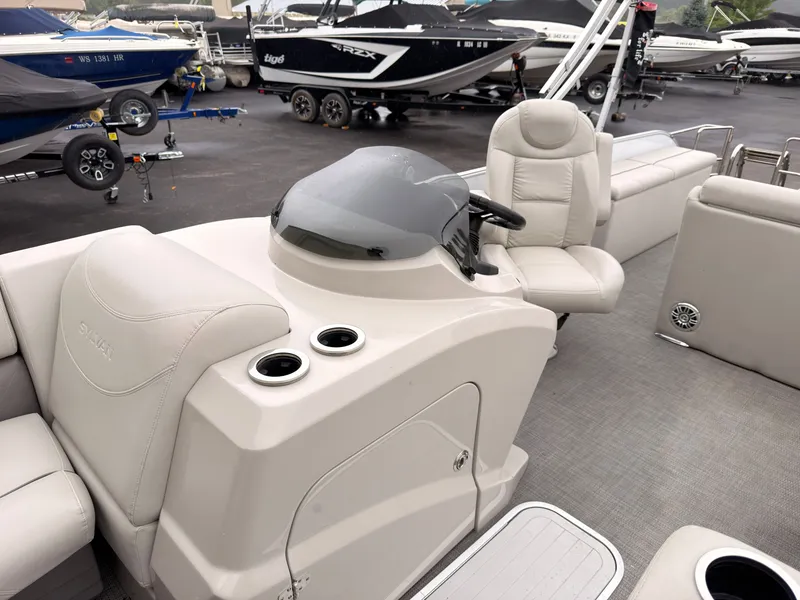 Slide: The Image of The image shows the cockpit of a 2017 Sylvan MIRAGE 8524 DL with beige seating. - 27