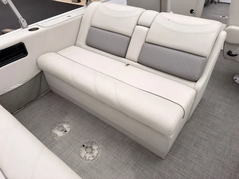 Slide: The Image of The image shows a white bench seat in a boat with gray flooring. - 49