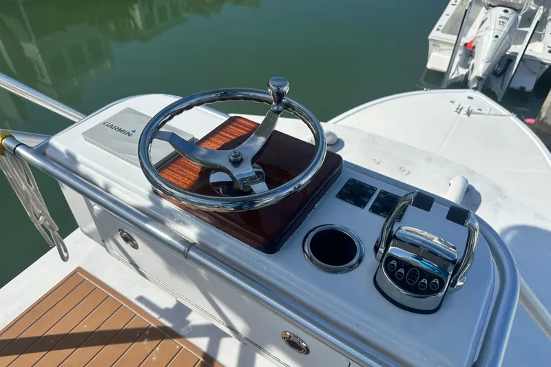 Slide: The Image of Helm of a 1996 Carolina Classic 28 boat with Garmin navigation system. - 5