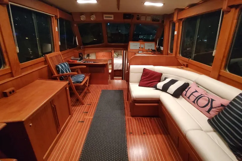 Slide: The Image of Luxurious interior of 1996 Grand Banks Eastbay 40 Flybridge with wood finish and cozy seating. - 23