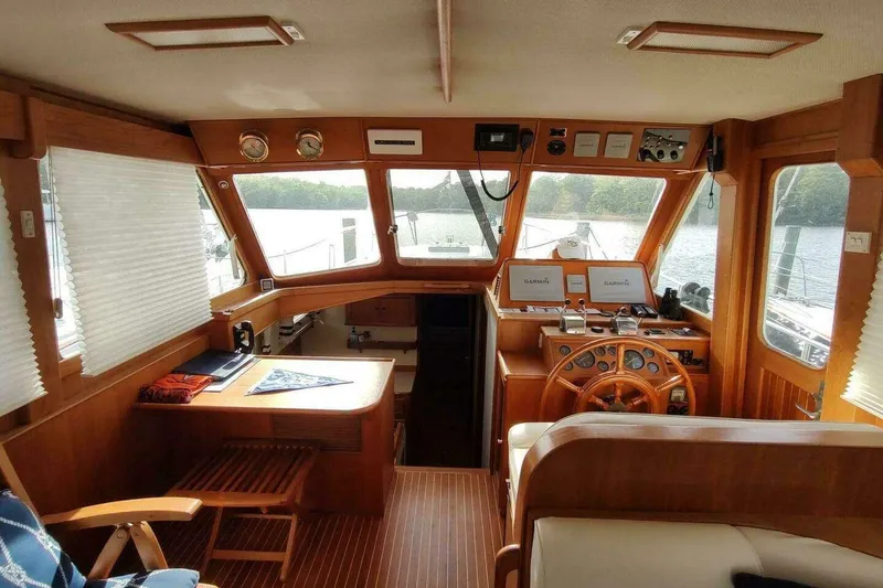 Slide: The Image of Interior of 1996 Grand Banks Eastbay 40 Flybridge with wooden helm and navigation equipment. - 26