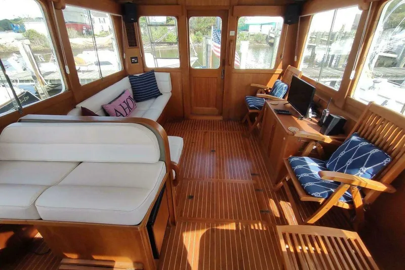 Slide: The Image of Luxurious 1996 Grand Banks Eastbay 40 Flybridge interior with elegant wood finish and comfortable seating. - 38