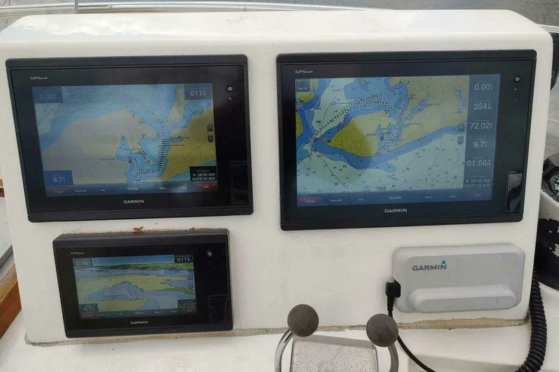 Slide: The Image of Garmin navigation displays on 1996 Grand Banks Eastbay 40 Flybridge boat dashboard. - 20