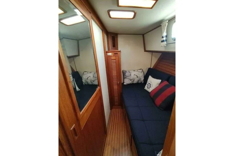 Slide: The Image of Cozy cabin interior of 1996 Grand Banks Eastbay 40 Flybridge with nautical decor. - 60
