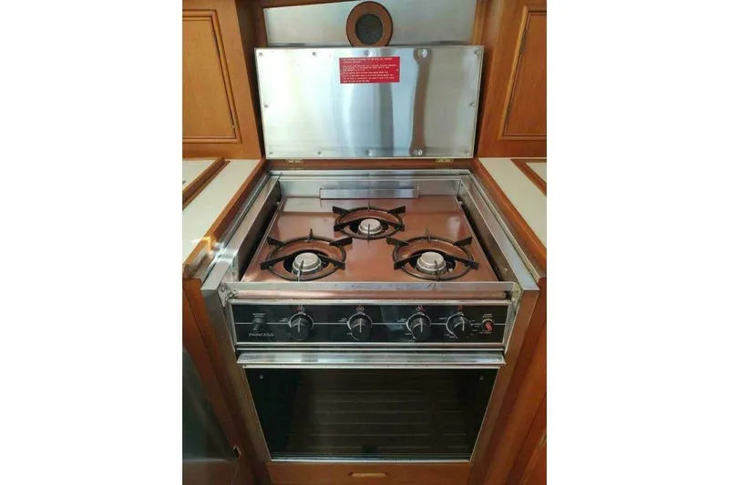 Slide: The Image of Gas stove and oven in 1996 Grand Banks Eastbay 40 Flybridge yacht kitchen. - 55