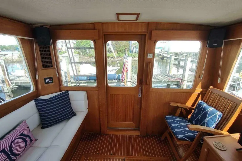 Slide: The Image of Interior of 1996 Grand Banks Eastbay 40 Flybridge with wooden finish and nautical decor. - 41