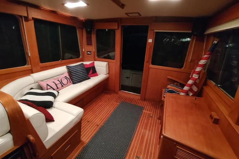 Slide: The Image of Luxurious 1996 Grand Banks Eastbay 40 Flybridge interior with cozy seating and nautical decor. - 25