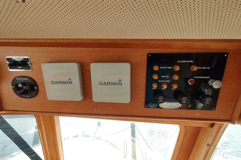 Slide: The Image of Control panel of a 1996 Grand Banks Eastbay 40 Flybridge with Garmin devices. - 30