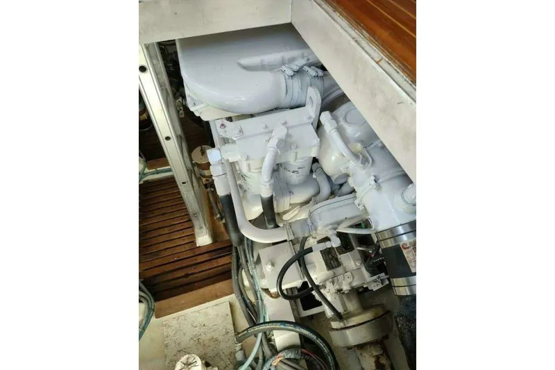 Slide: The Image of Engine compartment of 1996 Grand Banks Eastbay 40 Flybridge, showcasing mechanical components. - 81