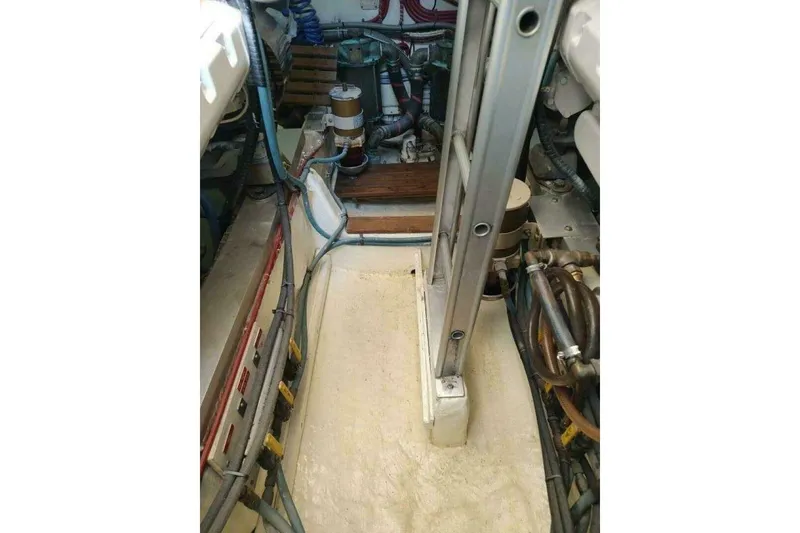 Slide: The Image of Engine room of 1996 Grand Banks Eastbay 40 Flybridge with visible machinery and wiring. - 78