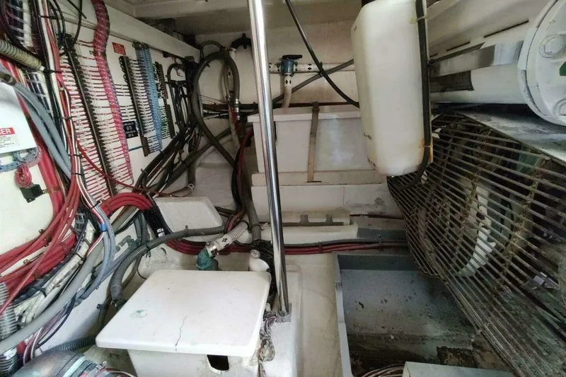 Slide: The Image of Engine room of 1996 Grand Banks Eastbay 40 Flybridge with wiring and equipment. - 87
