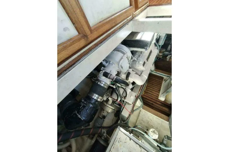 Slide: The Image of Engine compartment of 1996 Grand Banks Eastbay 40 Flybridge, showcasing mechanical components. - 82