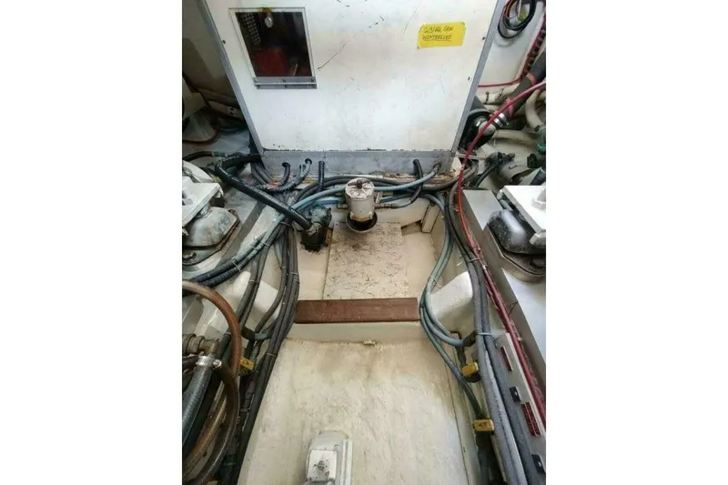 Slide: The Image of Engine room of 1996 Grand Banks Eastbay 40 Flybridge with visible wiring and components. - 91