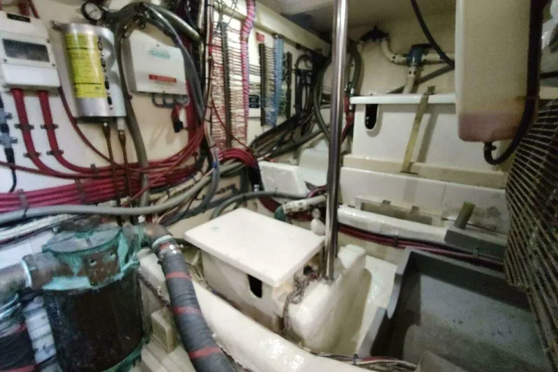 Slide: The Image of Engine room of 1996 Grand Banks Eastbay 40 Flybridge with wiring and equipment. - 88