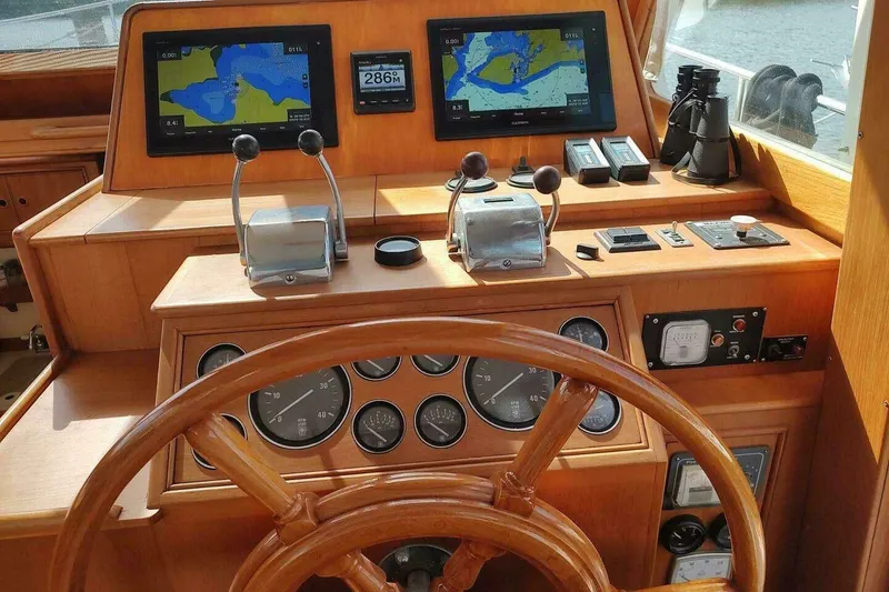 Slide: The Image of Helm of 1996 Grand Banks Eastbay 40 Flybridge with navigation screens and controls. - 33
