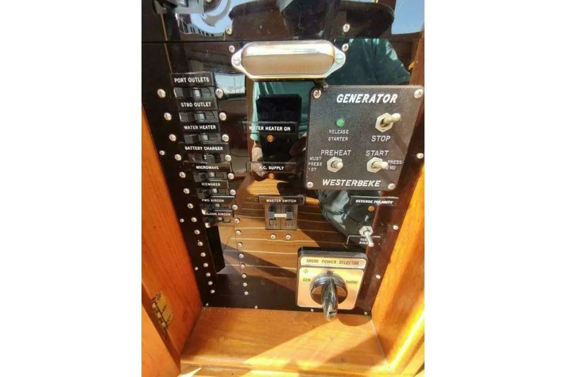 Slide: The Image of Control panel of a 1996 Grand Banks Eastbay 40 Flybridge boat. - 37