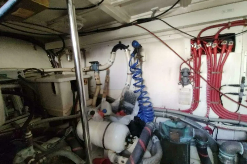 Slide: The Image of Engine room of 1996 Grand Banks Eastbay 40 Flybridge with wiring and equipment. - 89
