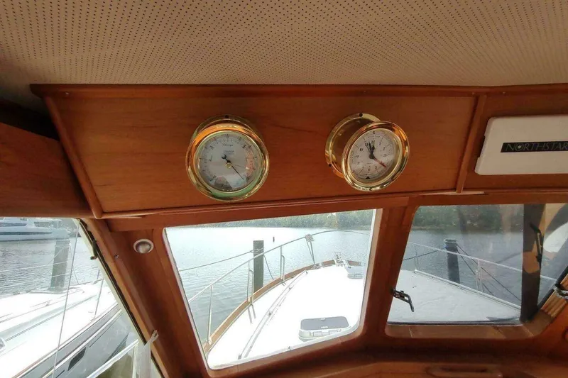 Slide: The Image of Interior view of 1996 Grand Banks Eastbay 40 Flybridge with nautical instruments. - 28