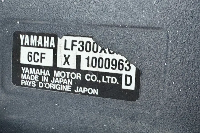Slide: The Image of Label on Yamaha motor, model LF300XCA, made in Japan, on Grady White Bimini 306. - 25