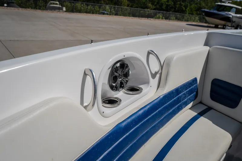 Slide: The Image of Interior of a 2012 Nautical NRG 30 boat with blue and white seating. - 34