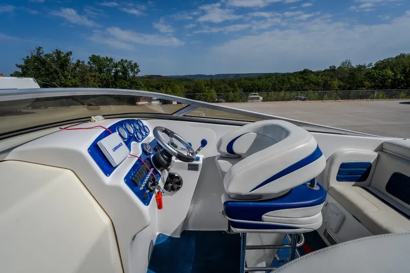 Slide: The Image of Cockpit of 2012 Nautical NRG 30 boat with steering wheel and control panel. - 18