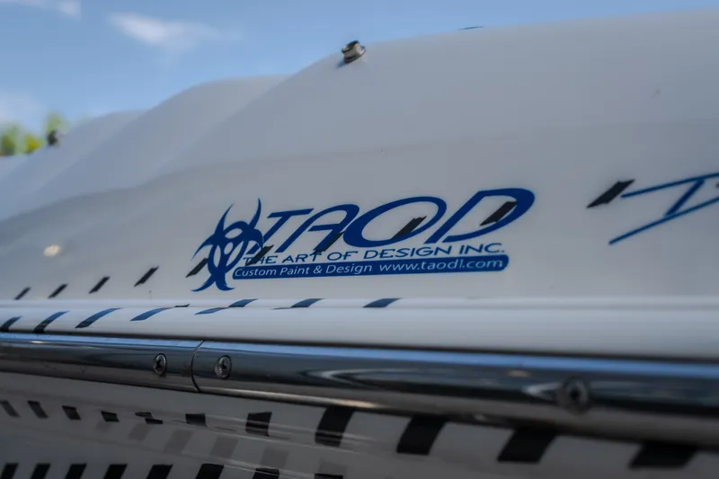 Slide: The Image of Close-up of Nautical NRG 30 boat, featuring TAOD custom paint design, 2012 model. - 58