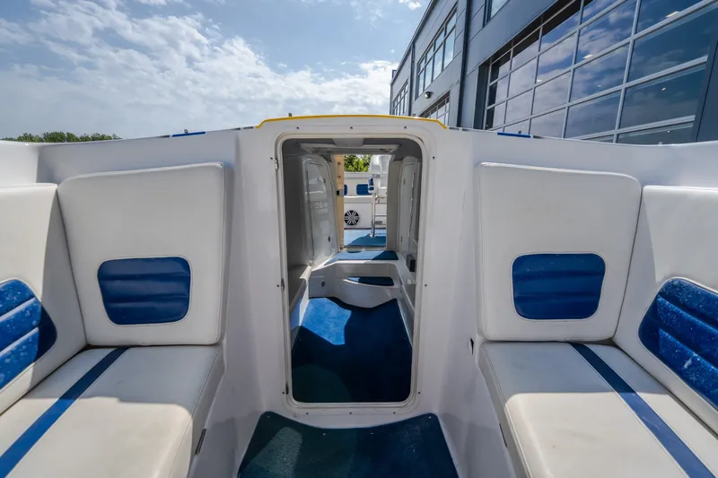 Slide: The Image of Interior view of 2012 Nautical NRG 30 boat with blue and white seating. - 35