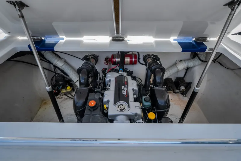 Slide: The Image of Engine compartment of a 2012 Nautical NRG 30 boat, showcasing the 8.2L engine. - 20