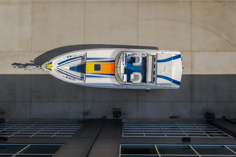 Slide: The Image of Overhead view of 2012 Nautical NRG 30 boat with colorful deck design. - 3