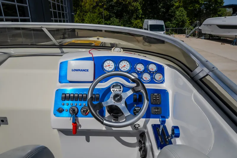 Slide: The Image of Cockpit of 2012 Nautical NRG 30 boat with steering wheel and control panel. - 15