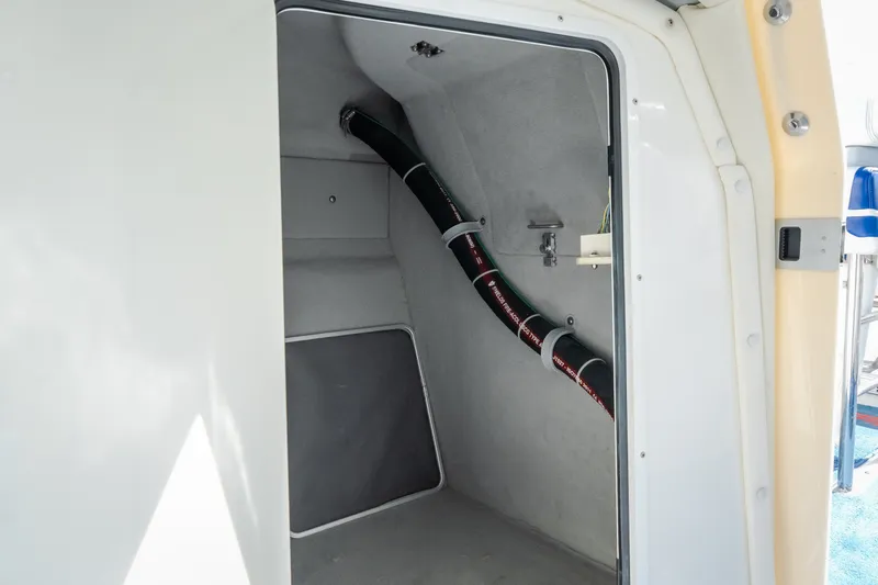 Slide: The Image of Interior view of a 2012 Nautical NRG 30 boat compartment with visible piping. - 31