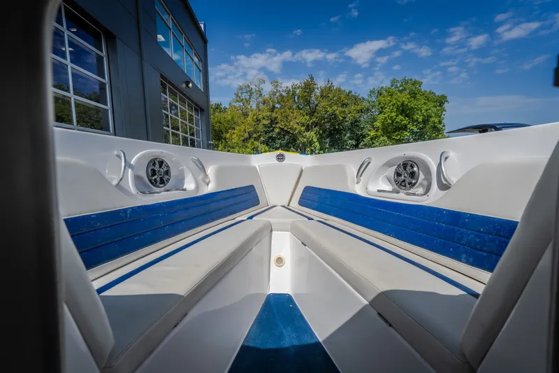 Slide: The Image of Interior view of 2012 Nautical NRG 30 boat with blue and white seating. - 24