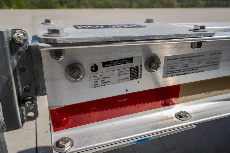 Slide: The Image of Close-up of a Nautical NRG 30 trailer label, showcasing specifications and tire information. - 65