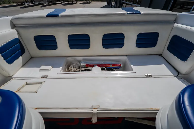 Slide: The Image of Interior seating of a 2012 Nautical NRG 30 boat with storage compartment. - 40
