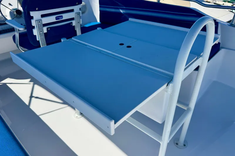 Slide: The Image of Flybridge table 2. Leaves fold easily to reduce width - 13