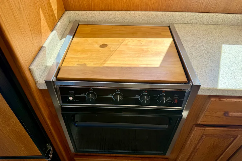 Slide: The Image of Cutting board on top of stove - 28