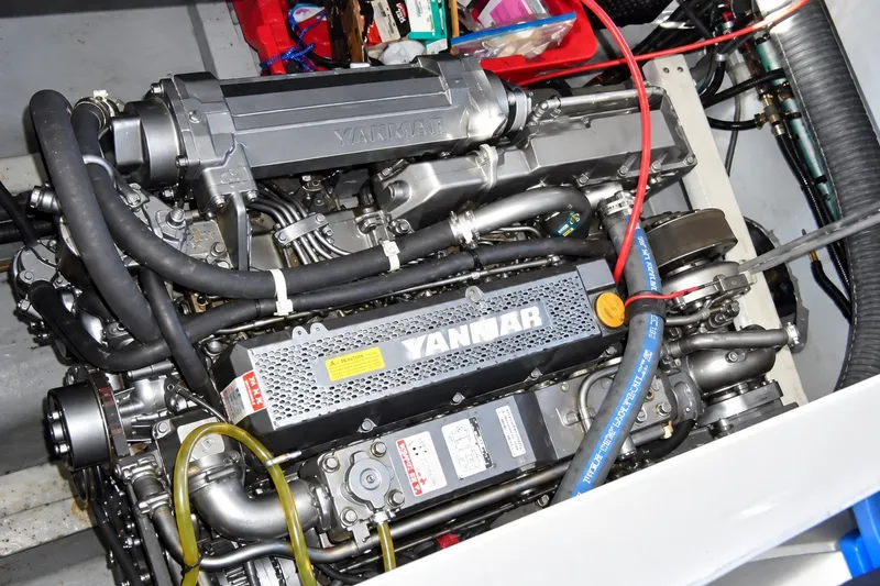Slide: The Image of Engine compartment of a 1999 Mainship 350 Trawler with Yanmar engine components. - 55