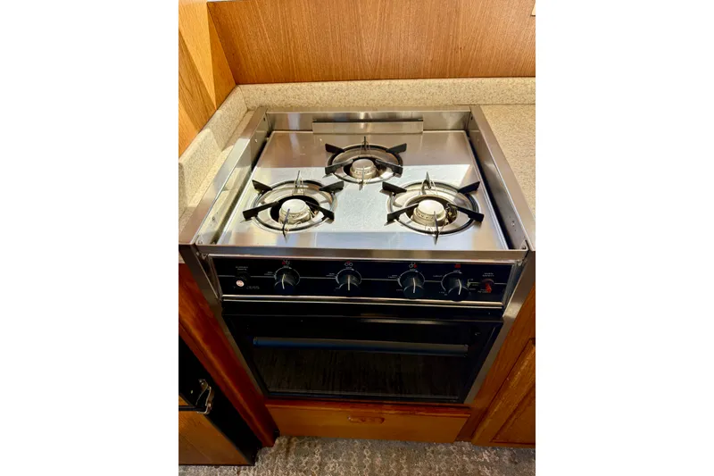 Slide: The Image of Stainless steel stove with three burners , oven and broiler - 29