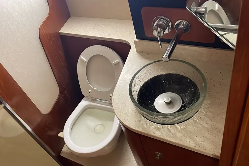 Slide: The Image of Luxurious bathroom in 2009 Tiara Yachts 3900 Sovran with modern sink and toilet. - 27