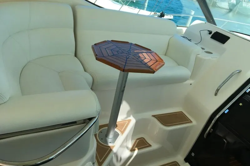 Slide: The Image of Luxurious interior of 2009 Tiara Yachts 3900 Sovran with elegant seating and wooden table. - 16