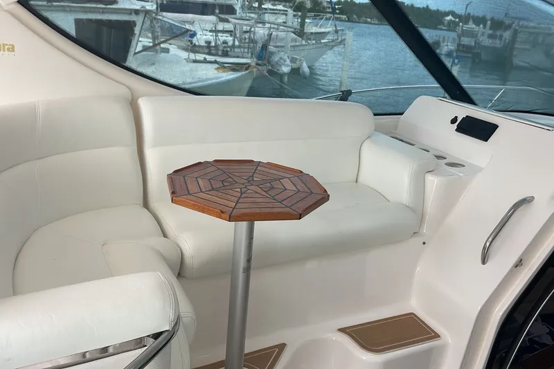 Slide: The Image of Luxurious interior of 2009 Tiara Yachts 3900 Sovran with white seating and wooden table. - 26