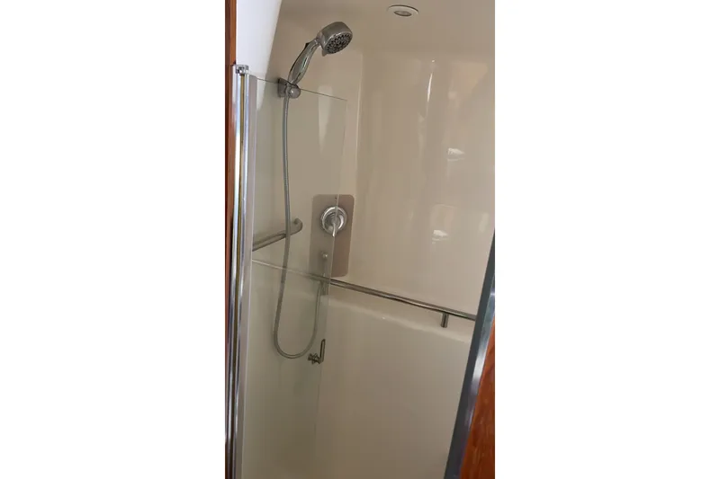 Slide: The Image of Shower area in 2009 Tiara Yachts 3900 Sovran, featuring modern fixtures and glass door. - 28