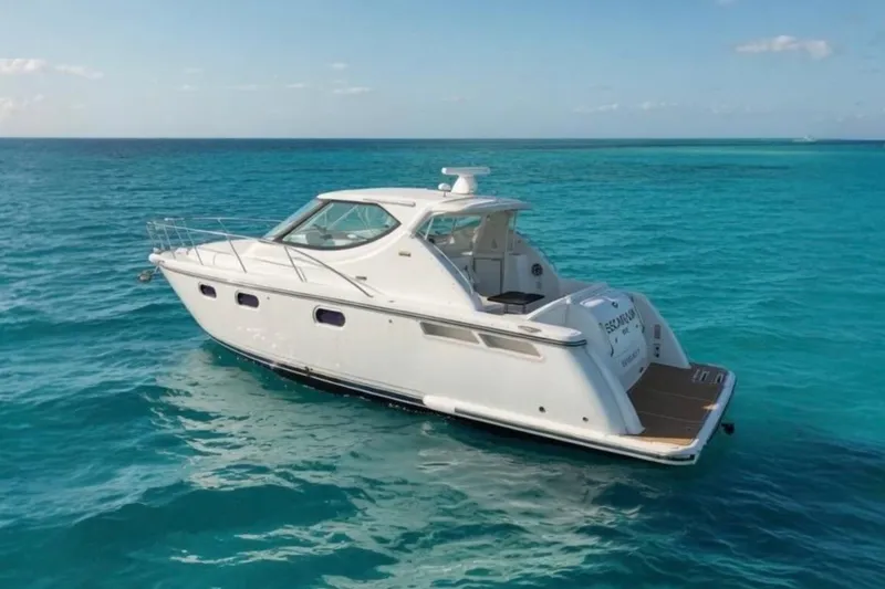 The Image of 2008 Tiara Yachts 3900 Sovran cruising on clear blue ocean waters. - 0